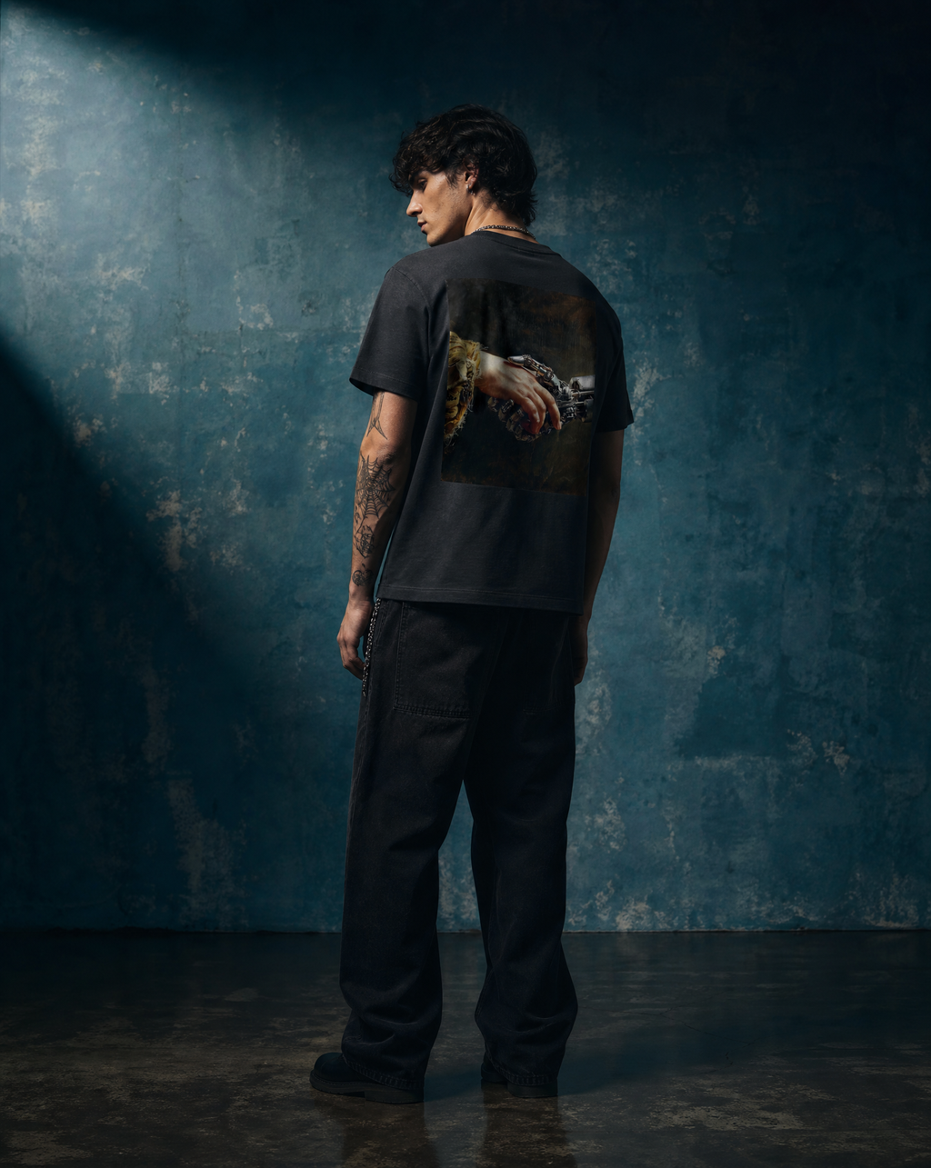 Creation I tee, premium studio shot on aged teal backdrop